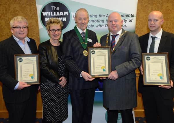 Presentation of the William Keown Trust award for Larne Mraket Yard. Featured are Paul Hannah, Mascott Construction; Hazel Bell, Larne Borough Council; Trevor Taylor, Deputy President of The William Keown Trust; Drew Niblock, Deputy Mayor of Larne Borough Council; and Terry Hamilton, Kennedy Fitzgerald Architects. INLT 03-625-CON