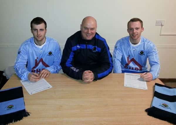 Institute's new signings Stephen (left) and Dean Curry pictured alongside boss Paul Kee.