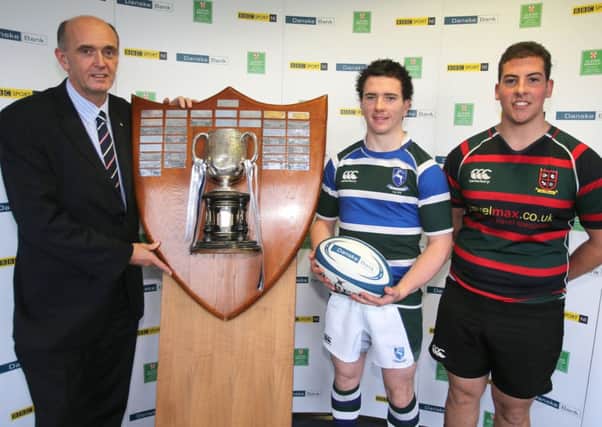Cambridge House First XV captain Christopher Da Mata (right) pictured with Grosvenor Grammar captain Jamie McMullan and Ivan McMinn, Head of Corporate Banking at Danske Bank, at the recent Schools' Cup draw. Picture: John Dickson.