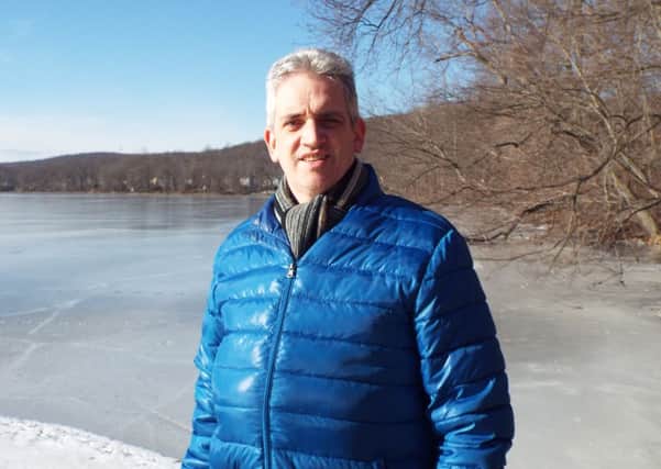 Portrush man Stephen Eason pictured at Lake Shongum, Randolph, New Jersey, which is completely frozen to a depth of several inches
. INCR03-14