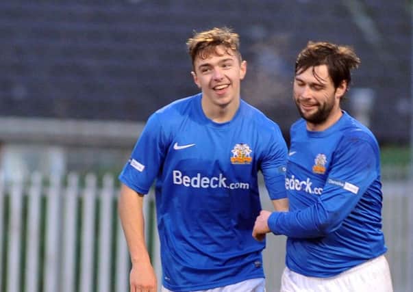Glenavon's Robbie McDaid,
celebrates with Gary Hamilton after scoring to make it 6-0
 during Saturday's Irish Cup tie at Mourneview Park.