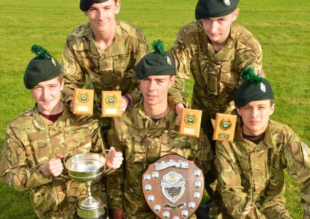 Celebrating a dazzling selection of awards won in the Northern Ireland Cadet Military Skills Competition contested recently at Magilligan Training Camp are the Ballymena Cadets who swept to victory in both the Physical Fitness and First Aid sections of the annual showcase challenge. Now faced with the challenge of making space in the trophy cabinet to house their latest awards are (back row, from left) Cadet Lance Corporal Harry McCaughey from Cambridge House School Cadet Detachment and Cadet Lance Corporal Ryan Brewster from Ballymena Detachment Army Cadet Force and (front row, from left) Cadet Richard McCully and Cadet Corporal Aaron George, both from the Ballymena ACF Detachment and Cadet Sergeant Richard Love, a member of the Ballyclare Detachment ACF.