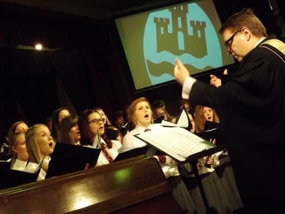 The award-winning Carrickfergus Grammar School Choir with musical director Edward Craig. INCT 03-705-CON CHOIR