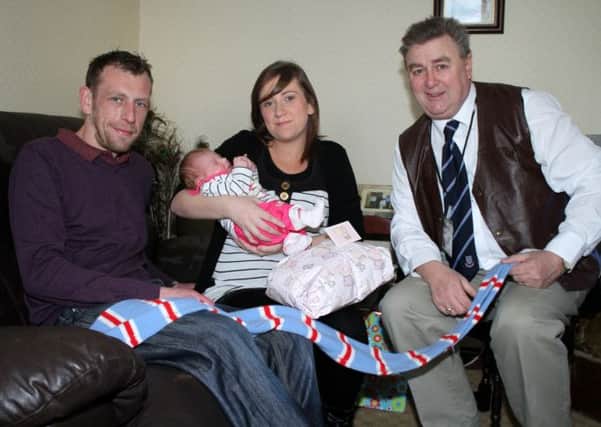 Sports Bond promoter Brian Thompson pictured with Stewart Gregg and agent Vicky Russell and young Lily Mae, who was born on Christmas Day. Picture: Reid McAuley.