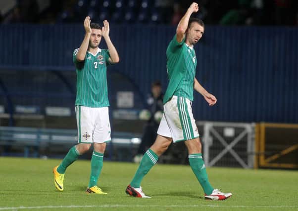 Daniel Lafferty (left) and Gareth McAuley celebrate after Northern Ireland's 1-0 win over Russia, last August.