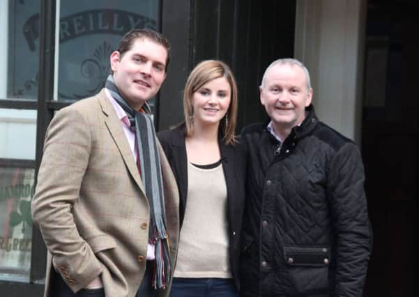 IRISH TV presenter Malcahi Cush with Donna and Mark Taggart.