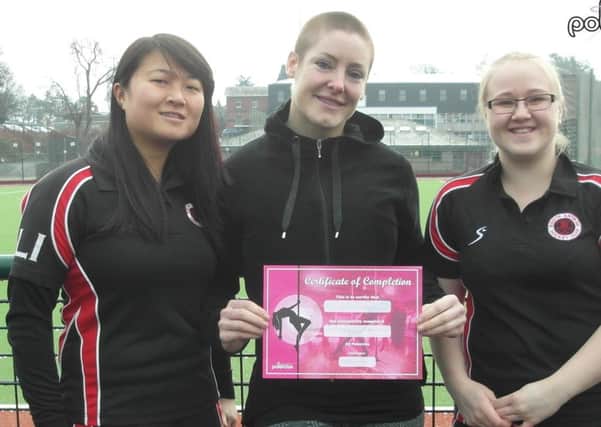 From left to right: Wendy Li (Chairperson at South Antrim Ladies), El Fegan at Polercise and Natalie Lowry (South Antrim Ladies hockey player).