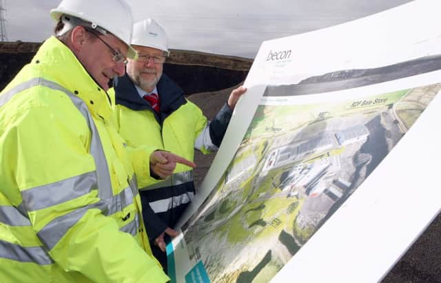 Ricky Burnett of arc21 and Ian Smith from the Becon Consortium check out the plans for the Hightown Quarry site. INNT 11-037-FP