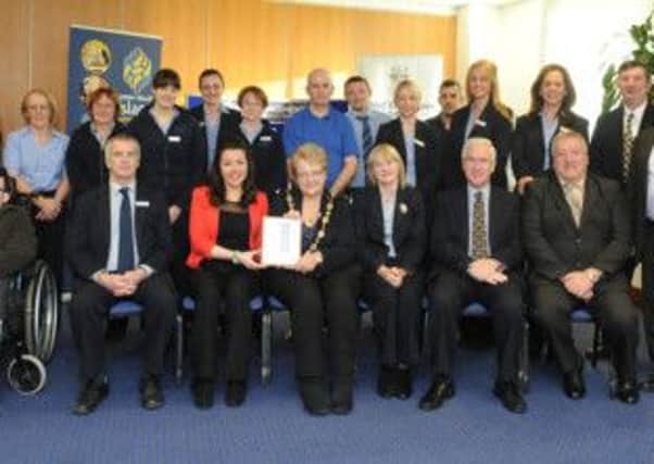 Lagan Valley Island's Centre Management Team celebrate achieving the prestigious Customer Service Excellence