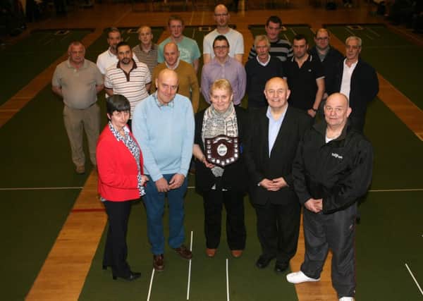 Family of the late Linda McCombe, Lorna McCombe, Alan McCombe, Hiliary Strain, Ivan McCombe and Adrian McCombe, along with competitors who took part in the bowls competition "Linda's Tournament" at St. Patrick's Church Hall. INBT03-212AC