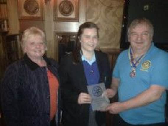 Pictured presenting Emma with a trophy in recognition of her achievement is President Jim Boylan and New Generations Chair, Brenda Caher. INBM04-14