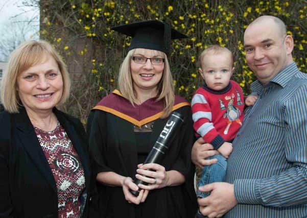 Event manager Jayne McCaw, from Glenarm, graduates from NRC Ballymena with a Level 4 HNC in Business passing with distinction. She is now studying for a BSC Hons in Business. Pictured with Jayne are Mum Patricia Esler, 13 month old son Charlie and husband Adrian. INBT 03- NRC 9.