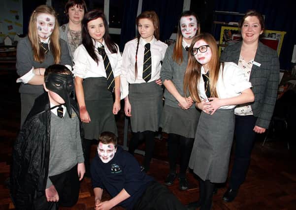 Looking a little sick at the Dunclug College open night were these students of the History department with teachers Miss Foster and Mrs Jackson. INBT 03-815H