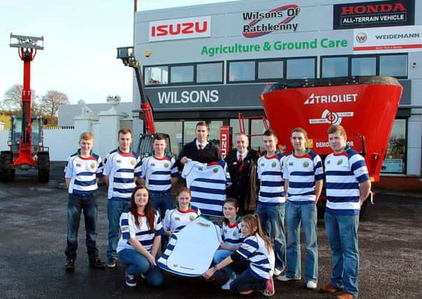"Trioliet"and "Weidemann" Agri-sales men John O'Boyle and Laurence McMullan, from Wilson's of Rathkenny, present members of Lisnamurrican Young Farmers Club with their new rugby shirts for the forth-coming year of events the club will take part in. INBT 03-916H