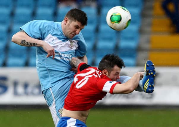 Ballymena United defender David Munster wins a header against Linfield's  Ivan Sproule during Saturdays Danske Bank Premiership game at the Showgrounds. Picture: Press Eye.