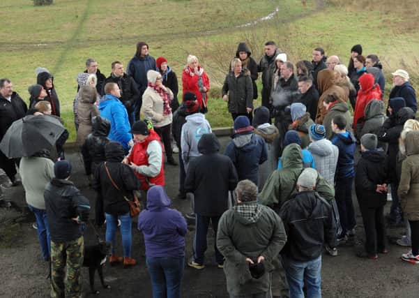 People gather at the Foyle Bridge to begin the search for Andy Quigley yesterday. (DER0214PG170)