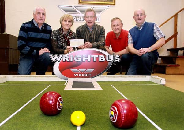 George Knowles, of Wrightbus, presents a sponsorship cheque to Lynda Turtle, secretary for the forthcoming Broughshane Bowling Club Singles tournament. Looking on are W.J. Surgenor, Doran Turtle, chairman; and Noel Graham, treasurer. INBT 04-932H