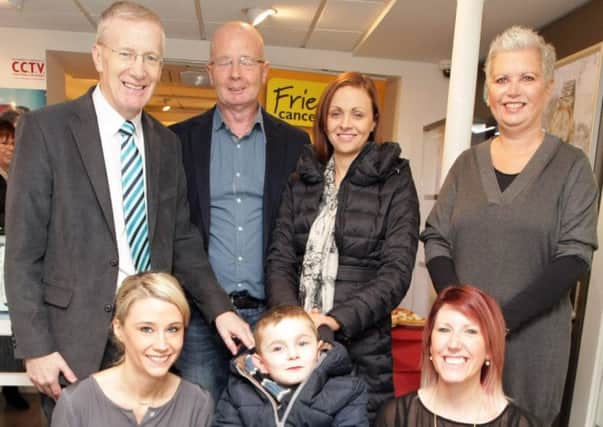 SUPPORT. Mum Charlene with her son Oliver, pictured along with Jennifer and Colin Bond of Bond Jewellers, staff members Lyndsay Bond and Lynsey Nicholl and MLA Gregory Campbell on Friday.CR4-112SC.
