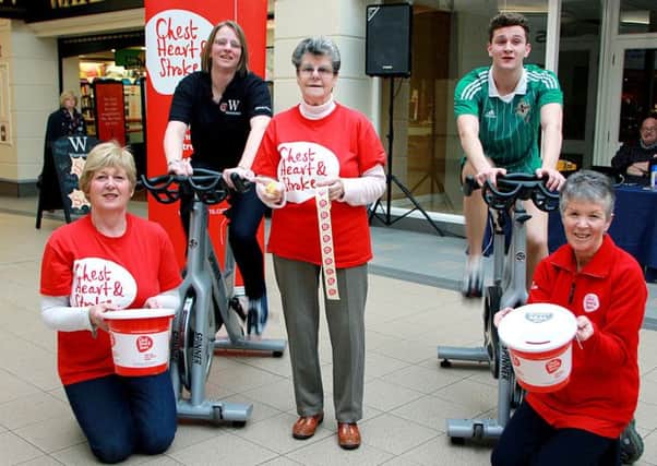 Chest Heart and Stroke Ballymena team of Valerie Saunders, Margaret McCroary and Maureen McCourt were busy in the Fairhill Shopping Centre on Saturday when team cyclists Victoria Murray and Joshua Kenny cycled for charity. INBT 04-929H