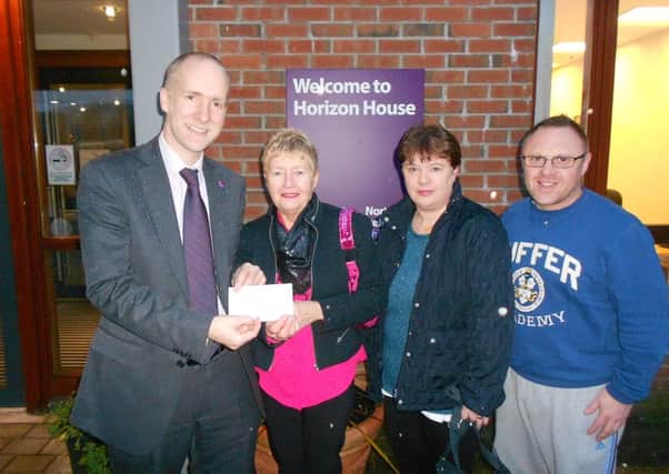 Mervyn Bunting and his aunt Pat visited the ChildrenHospice to hand over a cheque for £310 to Marcus Cooper, fundraising manager. The money was raised in memory of Rebekah Bunting by Billy Reid who shaved off his moustache of 30 years. Included is Billys wife Louise. INLT 04-654-CON