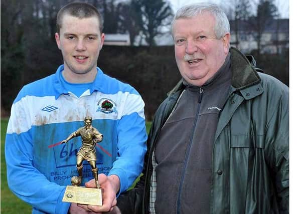 Charlie Johnston of the Harry Cavan Youth Cup Committee presented the Man of the Match award to Institute's Con Deeny.