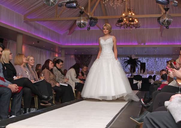 A model displays a wedding dress on the catwalk at the Wedding Showcase in the Waterfoot Hotel.  INLS 1315-513MT.