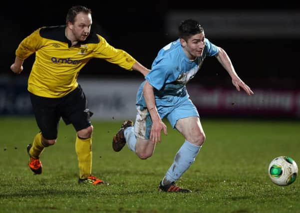 Ballymena's Michael Ruddy with H&W Welders' Mark Magennis during Tuesday night's Irish Cup fifth round replay at the Showgrounds. Picture: Press Eye.