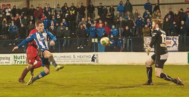 Coleraine's Ruairi Harkin beats Conor Devlin to put 3-1 up against Cliftonville in the 5th round replay of the Irish Cup