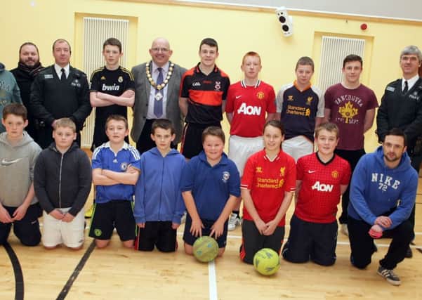 ON THE BALL. Pictured at Cloughmills Community Centre are teenagers during the first night of a new initiative to literally 'get the ball rolling' aimed at forming two football teams for the 12-16 yr olds. It is hoped they will eventually become a 'feeder' team for Cloughmills FC and included on the night along with Mayor Cllr John Finlay are members from the PSNI, who funded the project, coaches and Paddy Frew from C.A.T.INBM4-14 023SC.