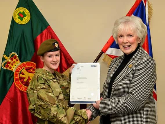 Celebrating the achievement of the BTEC Diploma is Cadet Corporal Shamragh Clark, also from Ballymoney. INBM05-14