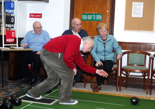 Rodney Gourley delivers a wood during the Services "A" v Golf Seniors bowls match. INBT 05-805H