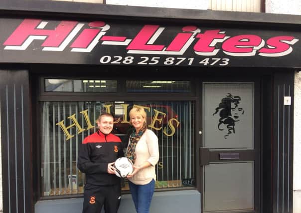 Chris Porter of Ahoghill Rovers receiving a Match ball from Tracy of Hi-Lites.