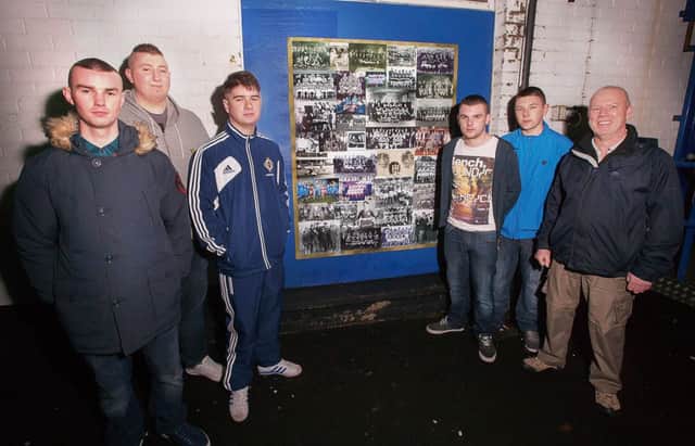 Football fans from Coleraine Youth Inclusion Project with mentor Michael Walker who were instrumental in the concept and design of the "Field of Dreams" project.