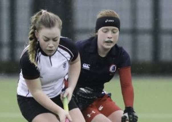 Carrick captain Chloe Mitchell is pursued by Zoe Wilson. Photo: Ronnie Moore