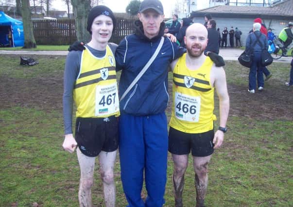 Connor McQuillan and Mark McKinstry with Fit N Running coach Gregory Walsh at Lurgan Park on Saturday.