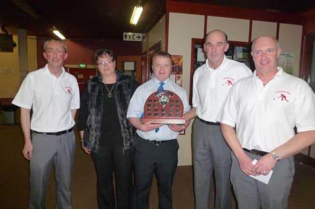 Open triple winners Nigel Gamble, Edwin Irwin and Nigel McMullan receiving trophy from Heather and Alan Gault who presented the trophy in memory of the late Jimmy Gault.