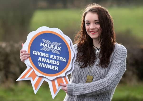 Chantelle Frampton celebrates winning the local Halifax Giving Extra Awards for Northern Ireland