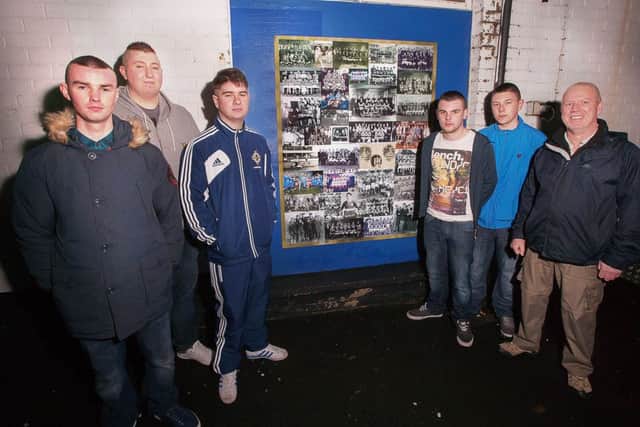 Football fans from Coleraine Youth Inclusion Project with mentor Michael Walker who were instrumental in the concept and design of the "Field of Dreams" project.