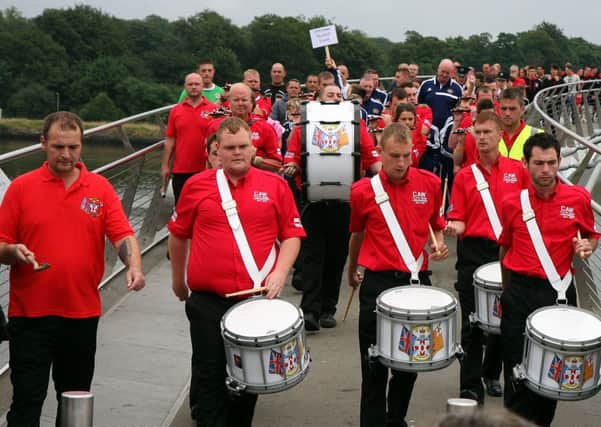 Members of Caw Flute Band, which has secured funding for musical tuition.