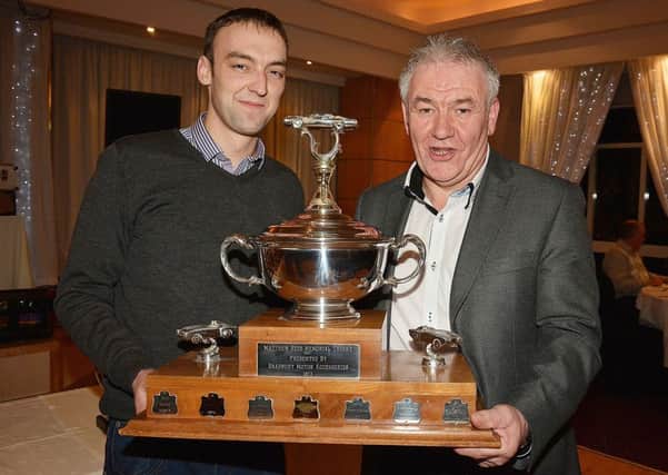 Gareth Mairs is pictured receiving the runner up driver of the year award from Mid-Antrim Motor Club President, Henry Campbell. INBT05-217AC