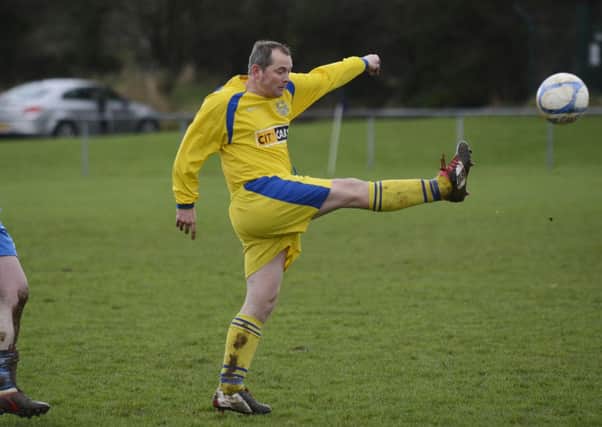 Churchill United defender Stuart Smallwoods clears his lines during their Matt Morrison Cup match against Heights FC. INLS0414-160KM