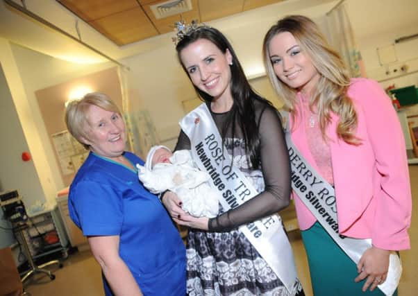 Pictured holding the new arrival of a baby boy for proud mum Natasha Curley is the current Rose of Tralee, Haley OSullivan, with Ward Sister Anne Hart, Western Trust and Gemma Blair, the Londonderry Rose.