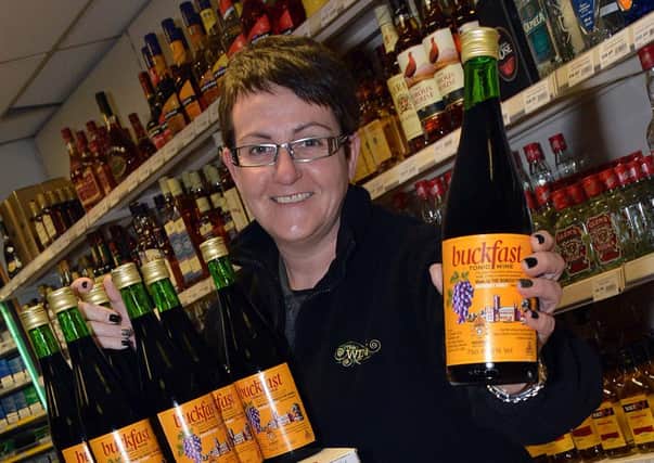 The Wine Company, Lurgan Town Centre, manager, Rachelle Banks, with some of the vast amount of Buckfast Tonic Wine sold each week. INLM05-206.