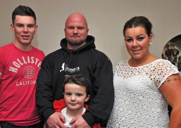 Stephen Millar - bodybuilding's current Mr World - with his wife Natalie and sons 11-year-old Ben and Daniel (18).INPT05-103gc