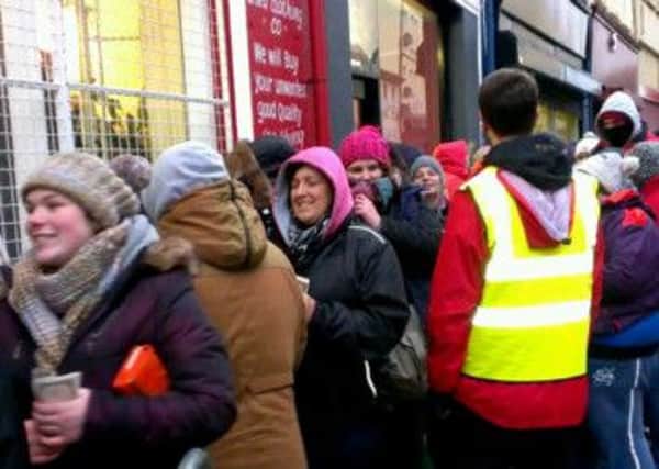 Fans queue up in Larne's Dunluce Street for tickets to Garth Brooks concerts.  INLT 06-675-CON