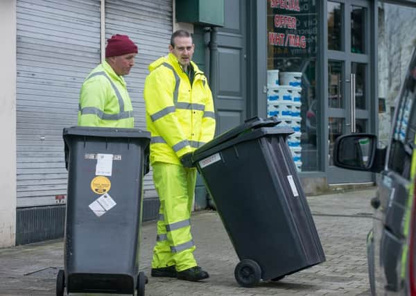 Kieran Dunne, of Derry City Council's cleansing department with Mayor Martin Reilly. The DoE has revealed small quantities of radioactive waste may be legitimately end up in local refuse sites by a method referred to as 'dustbin disposal.'