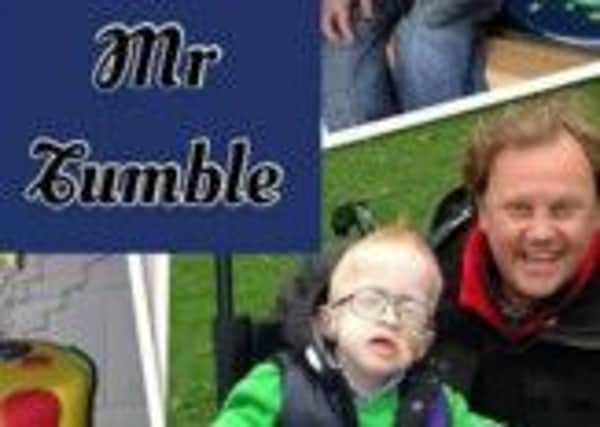 Blake McCaughey with Justin Fletcher in Lurgan Park.