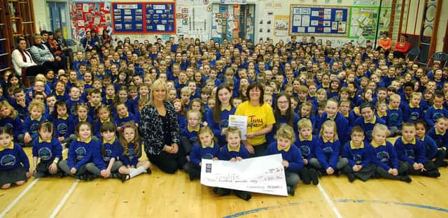 Camphill Primary School pupils last week presented a £200 cheque to Valerie Cromie of Tiny Life, which was the proceeds of their Christmas concert ticket sales. INBT 06-801H