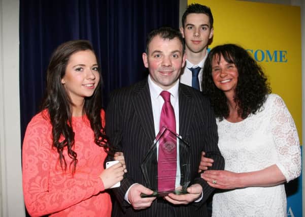 Eamonn Loughran, who was inducted into the Ballymena Sporting Hall of Fame, pictured wife his wife Angela, son Caolan and daughter Alicia.