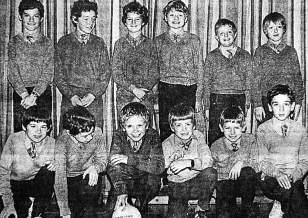 1983 - The junior football team of St. Mary's PS, Ballymena. Back row from left: J. Mullin, J. McCartney, P. McGuickin, G. Payne, C. Donnelly and D. Hasson. Front row from left: S. McGroggan, S. O'Kane, G. Graham, D. Parker and M. McGarry. INBT05-755F